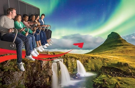 A group of people sit on a flight ride superimposed over a mountain scene